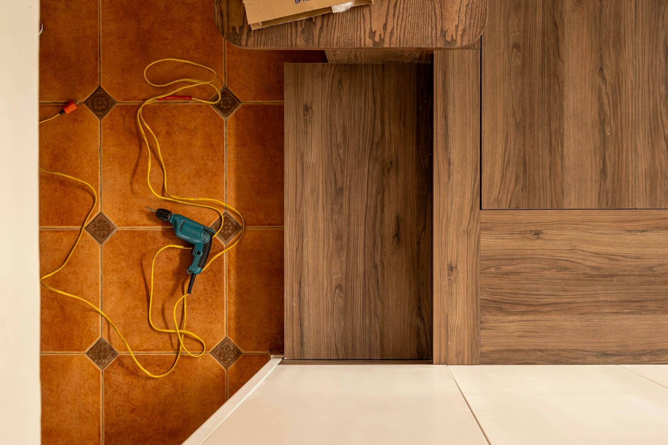 Installation work in progress with tools and flooring fitting